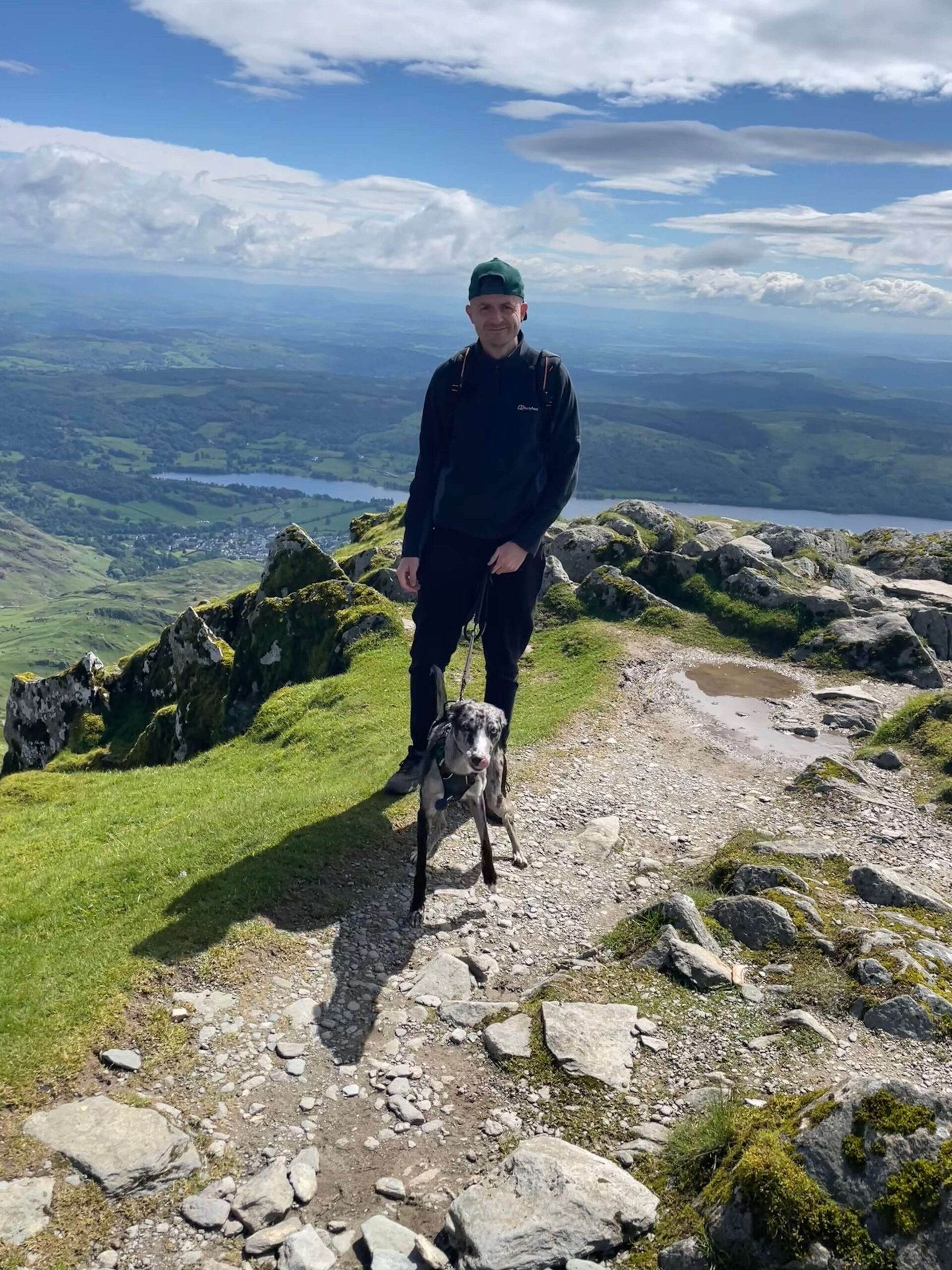 Sam and Bowie stand at the summit of the Old Man of Coniston after a long hike