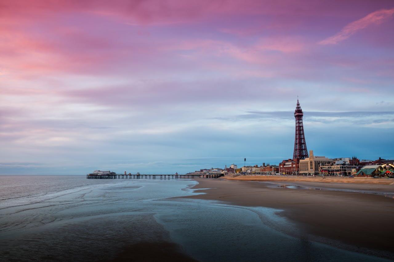 A dog friendly beach in Blackpool with purple skies